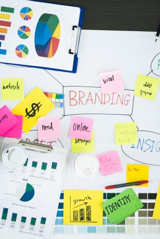 Top view of creative designer brainstorming ducument on wood table in meeting room